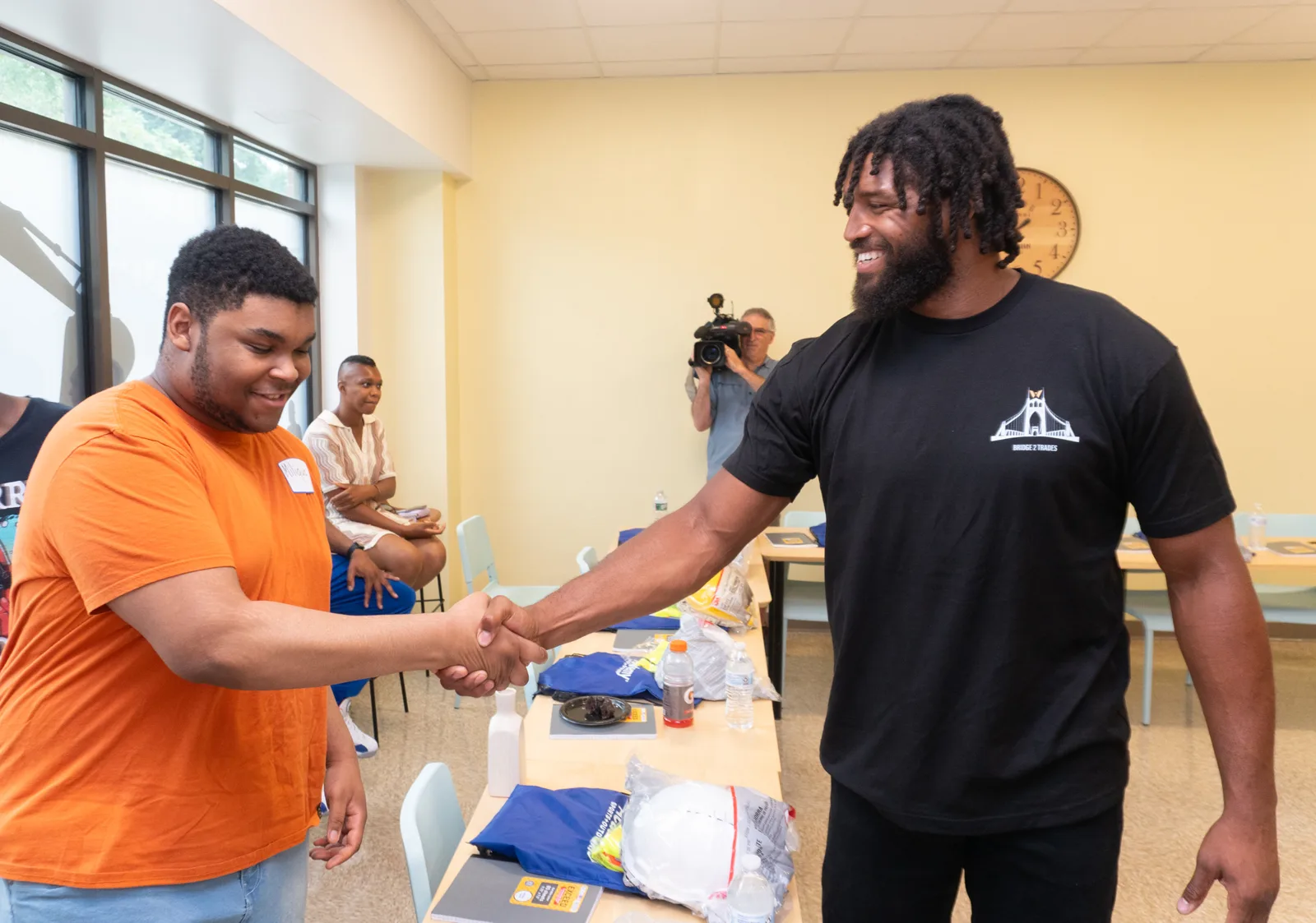 Deatrich Wise Jr. congratulating a Bridge 2 Trades participant