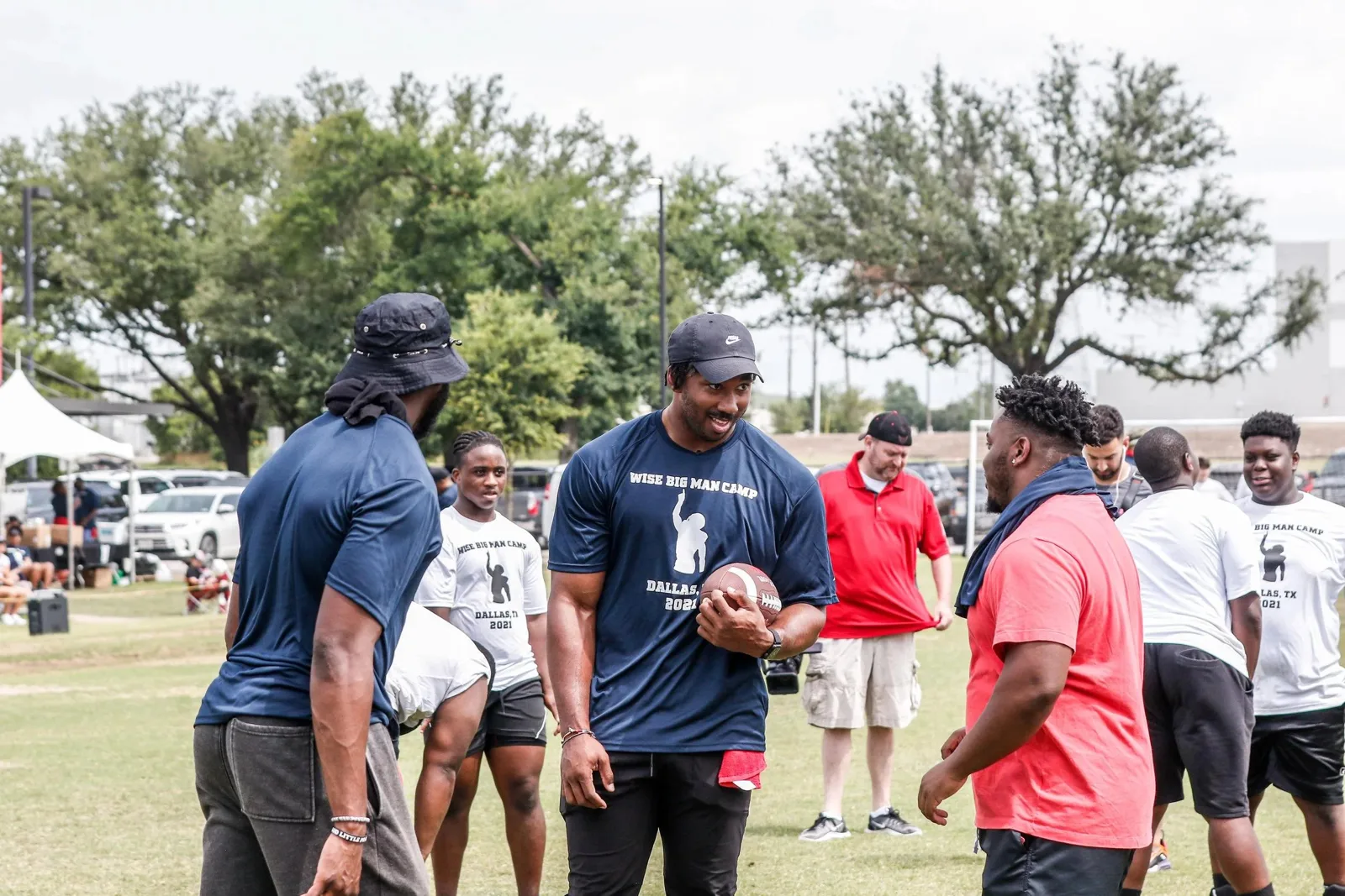 Coaches teaching technique to linemen at WISE Big Man Camp